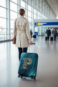 Housse de valise extensible avec motif lettre décorative dorée sur fond de vagues bleu turquoise – Valisora